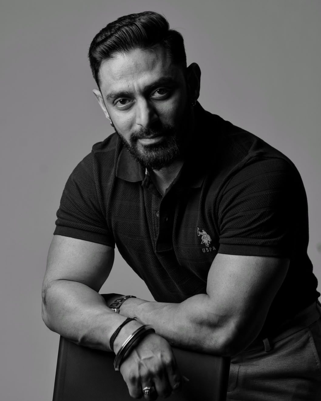 Portrait of Saveen Menon, arms folded